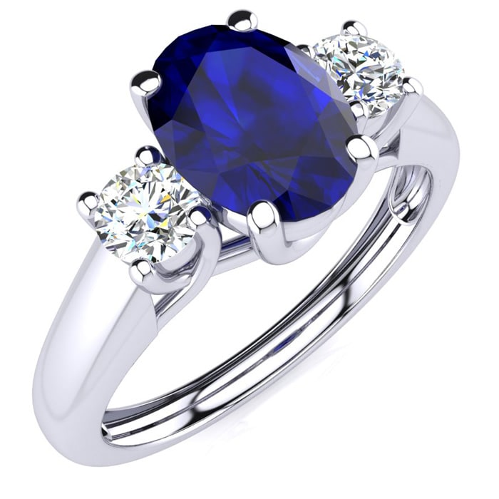 1 1/5 Carat Oval Shape Sapphire and Two Diamond Ring In 14 Karat White Gold