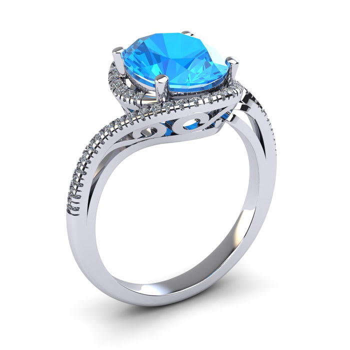 1 1/4 Carat Oval Shape Blue Topaz and Halo Diamond Ring In 14 Karat White Gold