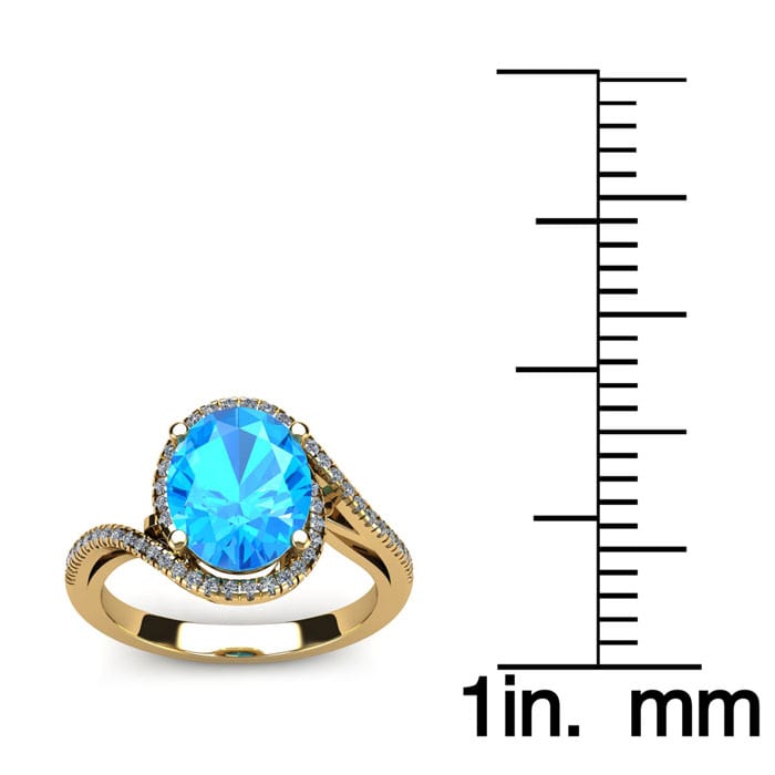 1 1/4 Carat Oval Shape Blue Topaz and Halo Diamond Ring In 14 Karat Yellow Gold