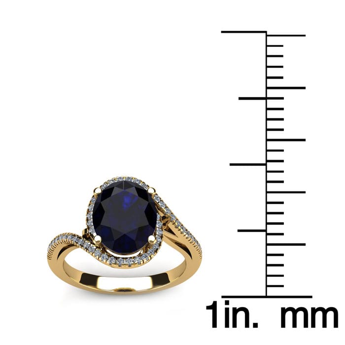 1 1/4 Carat Oval Shape Sapphire and Halo Diamond Ring In 14 Karat Yellow Gold