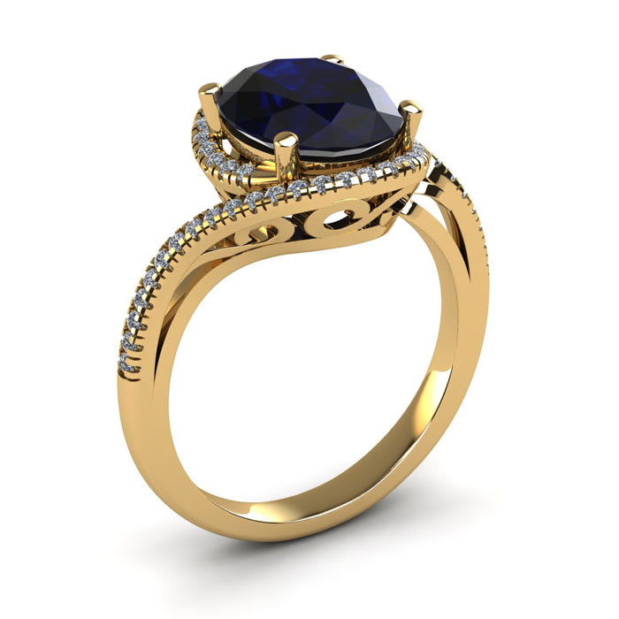 1 3/4 Carat Oval Shape Sapphire and Halo Diamond Ring In 14 Karat Yellow Gold