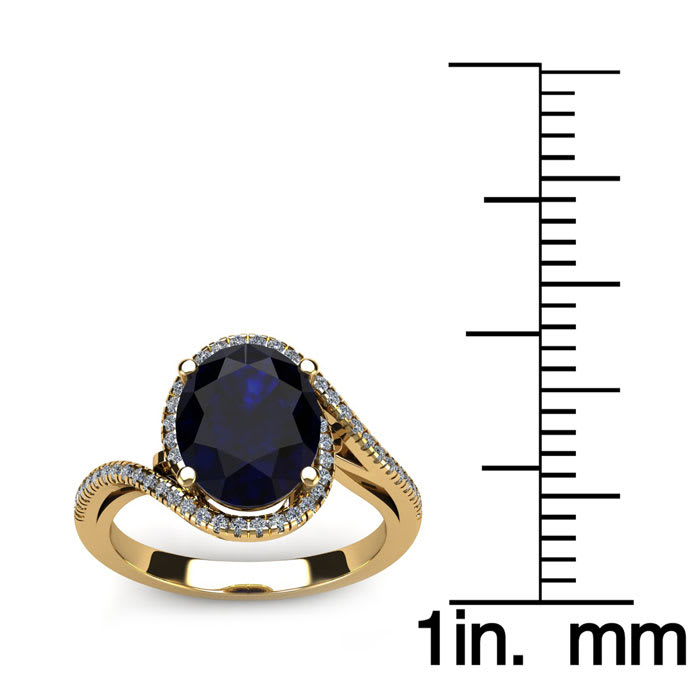1 3/4 Carat Oval Shape Sapphire and Halo Diamond Ring In 14 Karat Yellow Gold