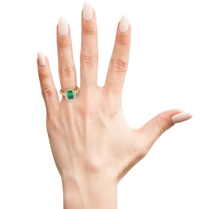1 Carat Emerald and Halo Diamond Ring In 14 Karat Yellow Gold