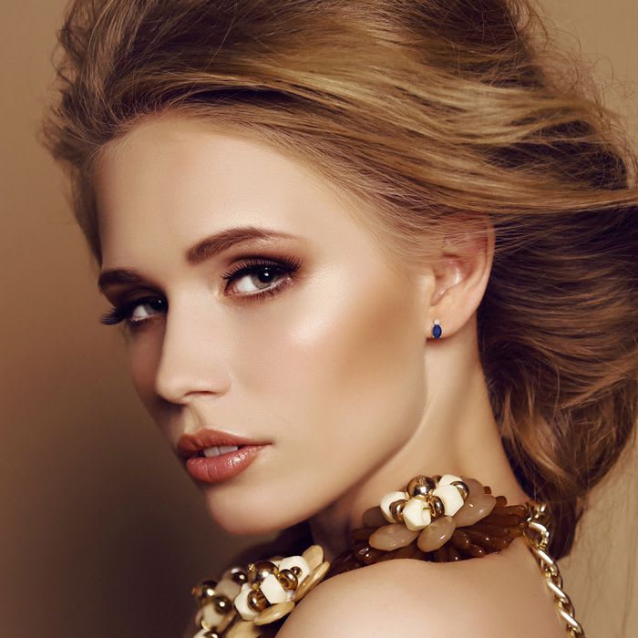 1 Carat Oval Tanzanite and Diamond Stud Earrings In 14 Karat Yellow Gold