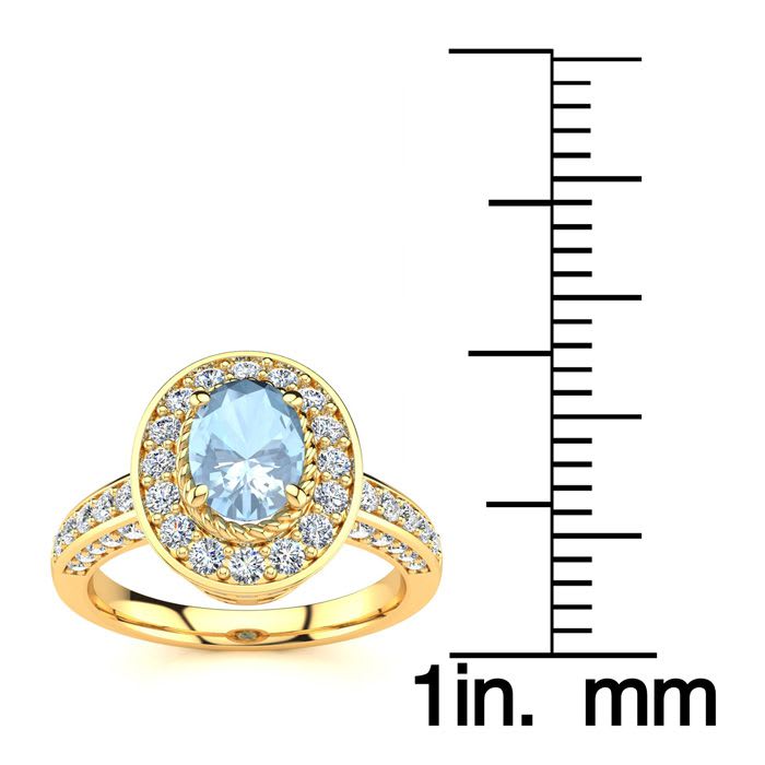 Aquamarine Ring: Aquamarine Jewelry: 1 1/2 Carat Oval Shape Aquamarine and Halo Diamond Ring In 14 Karat Yellow Gold