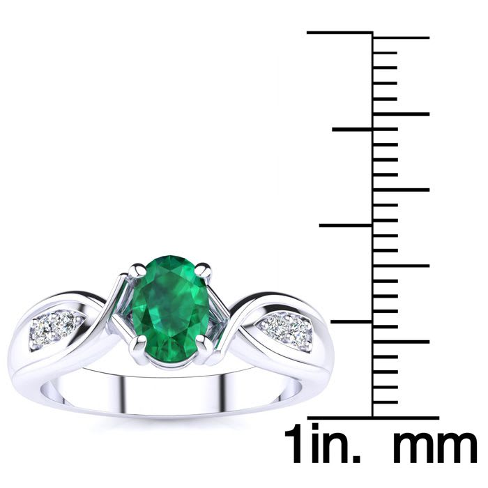 1 Carat Oval Shape Emerald and Four Diamond Ring In 10 Karat White Gold