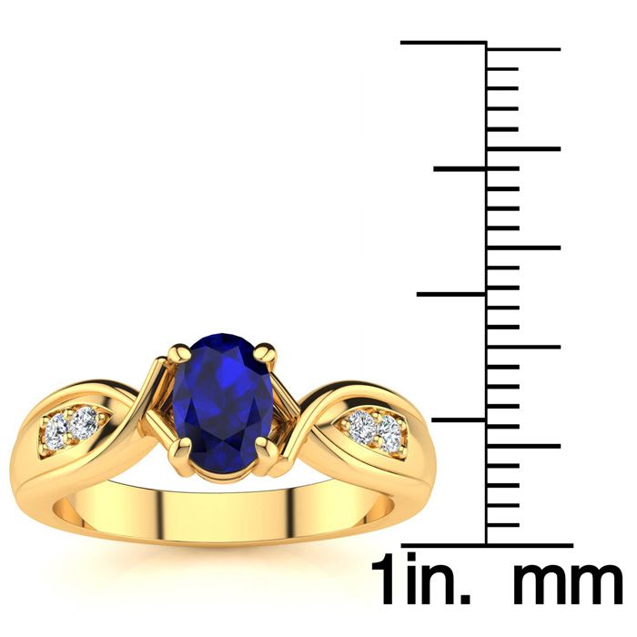 1 Carat Oval Shape Sapphire and Four Diamond Ring In 10 Karat Yellow Gold