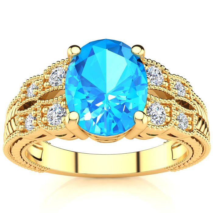 2 1/3 Carat Oval Shape Blue Topaz and Diamond Ring In 10 Karat Yellow Gold