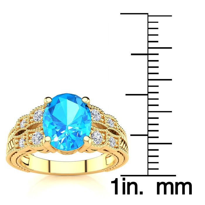 2 1/3 Carat Oval Shape Blue Topaz and Diamond Ring In 10 Karat Yellow Gold