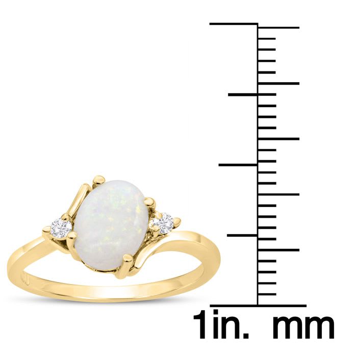 7/8 Carat Opal Ring and Two Diamonds In 14 Karat Yellow Gold