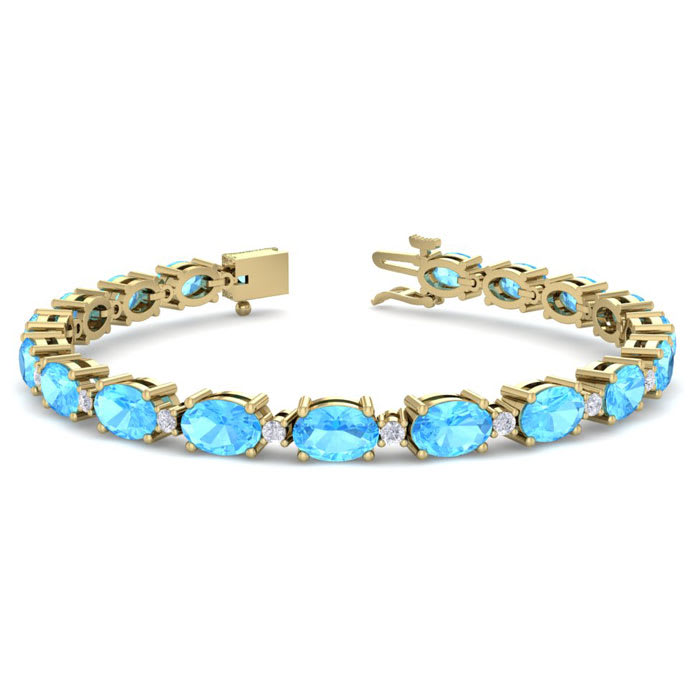 11 Carat Oval Shape Blue Topaz and Diamond Bracelet In 14 Karat Yellow Gold, 7 Inches