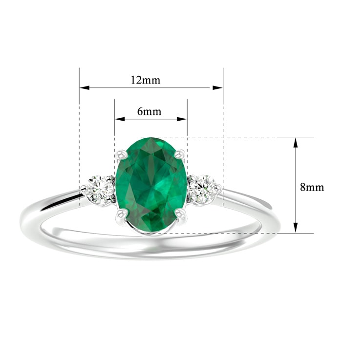 1 1/4 Carat Oval Shape Emerald and Two Diamond Ring In 14 Karat White Gold