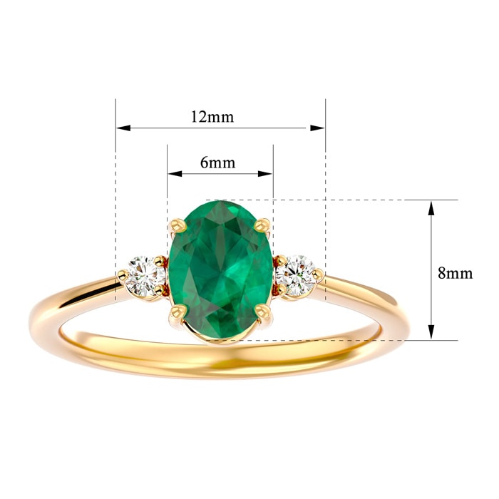 1 1/4 Carat Oval Shape Emerald and Two Diamond Ring In 14 Karat Yellow Gold