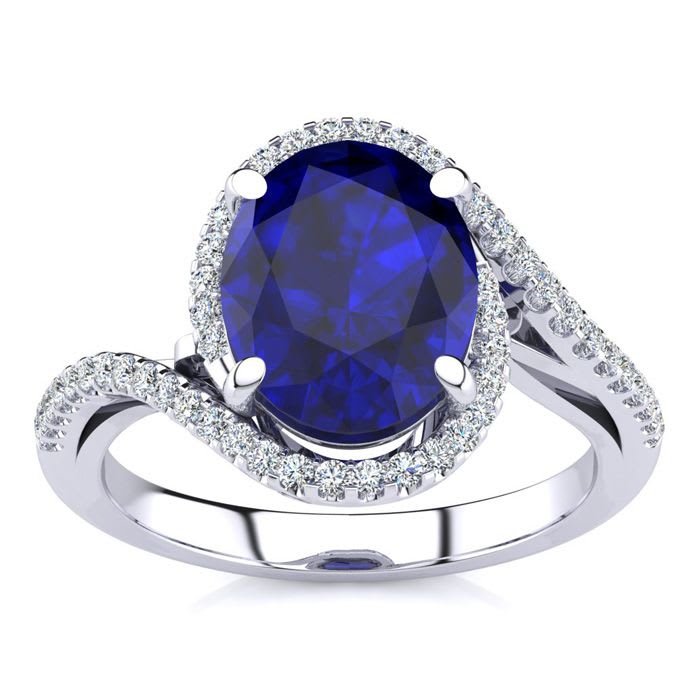 3 1/3 Carat Oval Shape Sapphire and Halo Diamond Ring In 18 Karat White Gold