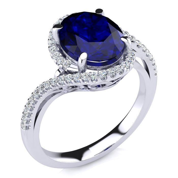 3 1/3 Carat Oval Shape Sapphire and Halo Diamond Ring In 18 Karat White Gold