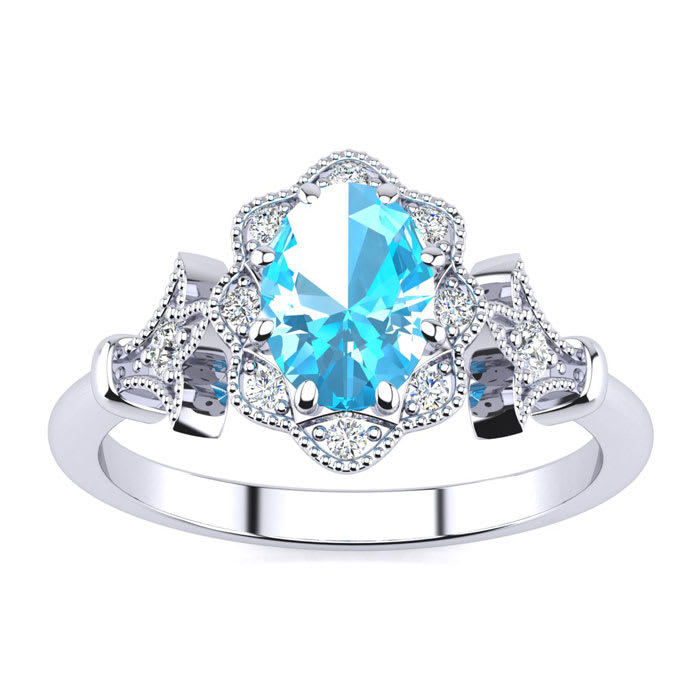Blue Topaz Ring: 1 Carat Oval Shape Blue Topaz and Halo Diamond Ring In Sterling Silver