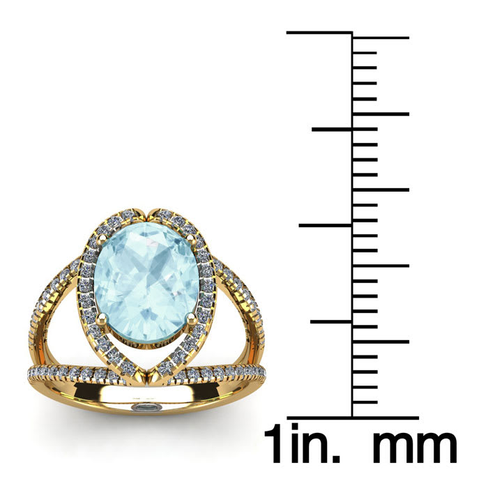 Aquamarine Ring: Aquamarine Jewelry: 1 1/2 Carat Oval Shape Aquamarine and Halo Diamond Ring In 14 Karat Yellow Gold
