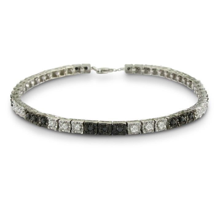 Sterling silver black diamond tennis bracelet with 50 alternating black and white diamonds.  Diamond content is 1 carat in  J/K color I2 clarity.
