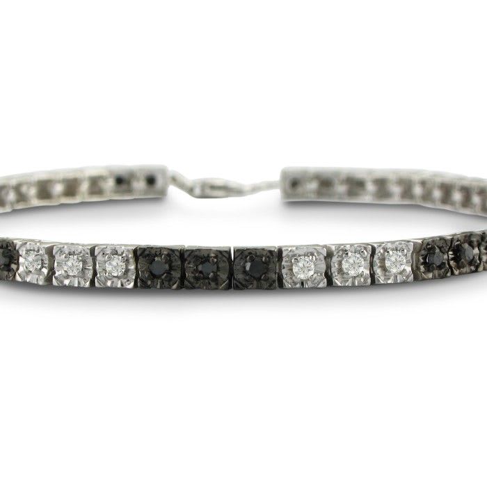 Sterling silver black diamond tennis bracelet with 50 alternating black and white diamonds.  Diamond content is 1 carat in  J/K color I2 clarity.