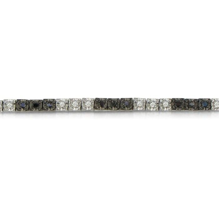 Sterling silver black diamond tennis bracelet with 50 alternating black and white diamonds.  Diamond content is 1 carat in  J/K color I2 clarity.