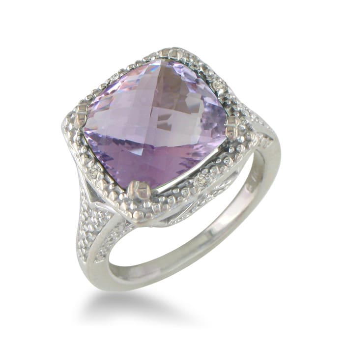 You will not believe this gorgeous  amethyst and diamond ring. Crafted in sterling silver and containing an appley green 4 carat total amethyst and diamonds.  The diamond content is .04 carat in J/K color and I2 clarity.  One Star diamonds.