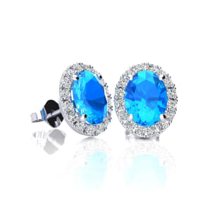 1 1/4 Carat Oval Shape Blue Topaz and Halo Diamond Stud Earrings In 14 Karat White Gold