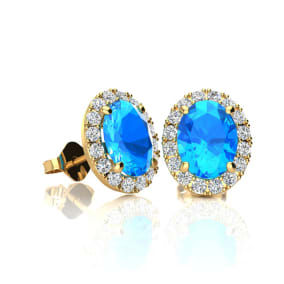 1 1/4 Carat Oval Shape Blue Topaz and Halo Diamond Stud Earrings In 14 Karat Yellow Gold