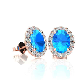 1 1/4 Carat Oval Shape Blue Topaz and Halo Diamond Stud Earrings In 14 Karat Rose Gold