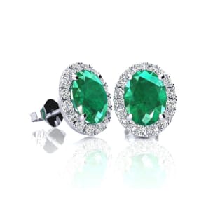 1 Carat Oval Shape Emerald and Halo Diamond Stud Earrings In 14 Karat White Gold