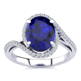 3 1/3 Carat Oval Shape Sapphire and Halo Diamond Ring In 14 Karat White Gold