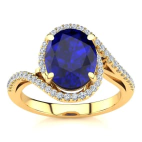 3 1/3 Carat Oval Shape Sapphire and Halo Diamond Ring In 14 Karat Yellow Gold