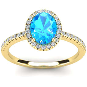 1 3/4 Carat Oval Shape Blue Topaz and Halo Diamond Ring In 14 Karat Yellow Gold