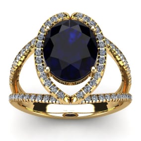 3 1/2 Carat Oval Shape Sapphire and Halo Diamond Ring In 14 Karat Yellow Gold