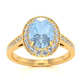 Aquamarine Ring: Aquamarine Jewelry: 1 1/2 Carat Oval Shape Aquamarine and Halo Diamond Ring In 14 Karat Yellow Gold