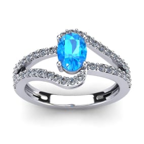 1 1/2 Carat Oval Shape Blue Topaz and Fancy Diamond Ring In 14 Karat White Gold