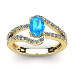1 1/2 Carat Oval Shape Blue Topaz and Fancy Diamond Ring In 14 Karat Yellow Gold