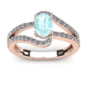 Aquamarine Ring: Aquamarine Jewelry: 1 1/4 Carat Oval Shape Aquamarine and Fancy Diamond Ring In 14 Karat Rose Gold