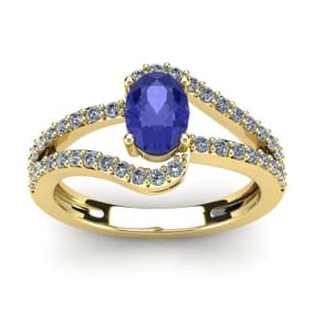 1 1/3 Carat Oval Shape Tanzanite and Fancy Diamond Ring In 14 Karat Yellow Gold