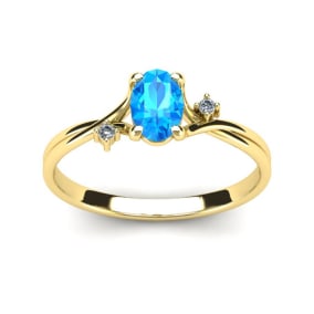 1/2 Carat Oval Shape Blue Topaz and Two Diamond Accent Ring In 14 Karat Yellow Gold