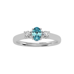 1/2 Carat Oval Shape Aquamarine and Two Diamond Ring In 14 Karat White Gold