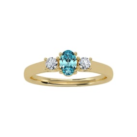 1/2 Carat Oval Shape Aquamarine and Two Diamond Ring In 14 Karat Yellow Gold