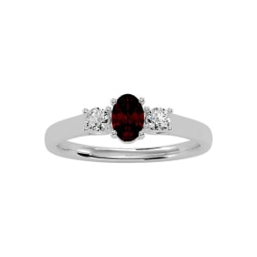 3/4 Carat Oval Shape Garnet and Two Diamond Ring In 14 Karat White Gold