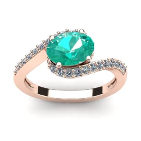 1 1/2 Carat Oval Shape Emerald and Halo Diamond Ring In 14 Karat Rose Gold
