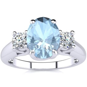 1 1/3 Carat Oval Shape Aquamarine and Two Diamond Ring In 14 Karat White Gold