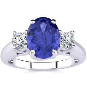 1 1/2 Carat Oval Shape Tanzanite and Two Diamond Ring In 14 Karat White Gold