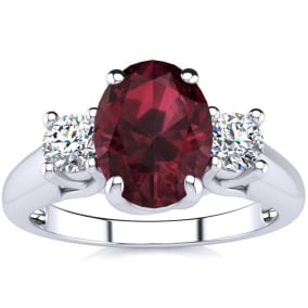 1 3/4 Carat Oval Shape Garnet and Two Diamond Ring In 14 Karat White Gold