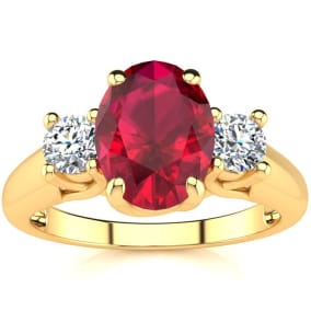 1 3/4 Carat Oval Shape Ruby and Two Diamond Ring In 14 Karat Yellow Gold