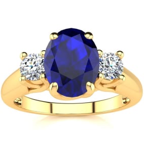 1 3/4 Carat Oval Shape Sapphire and Two Diamond Ring In 14 Karat Yellow Gold