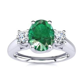1 Carat Oval Shape Emerald and Two Diamond Ring In 14 Karat White Gold