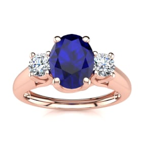 1 1/5 Carat Oval Shape Sapphire and Two Diamond Ring In 14 Karat Rose Gold